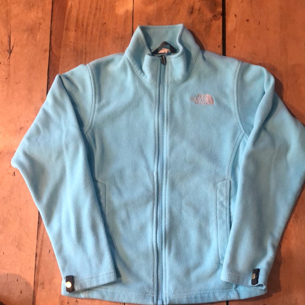 The North Face Girls size 10/12 fleece jacket in turquoise.